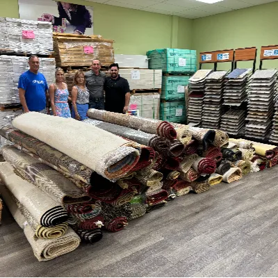 Taylor family donates carpet rolls to United Way